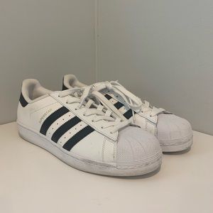 ADIDAS- white superstars with black stripes